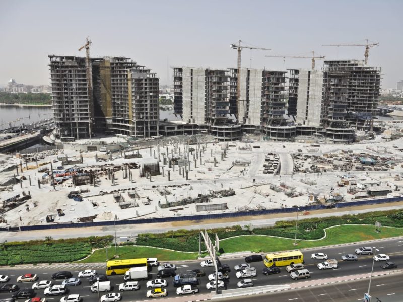 Urban Area with car on the street and high building