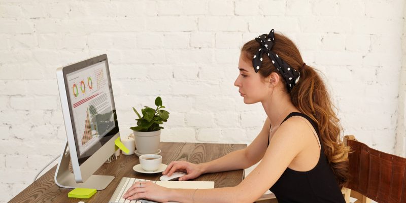 attractive-female-student-analyzing-financial-information-top-corporations-her-scientific-thesis-looking-financial-chart-home-interior-purposeful-girl-investigating-financial-tasks_11zon attractive-female-student-analyzing-financial-information-top-corporations-her-scientific-thesis-looking-financial-chart-home-interior-purposeful-girl-investigating-financial-tasks_11zon