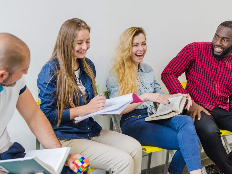 cheerful-students-having-conversation_11zon cheerful-students-having-conversation_11zon