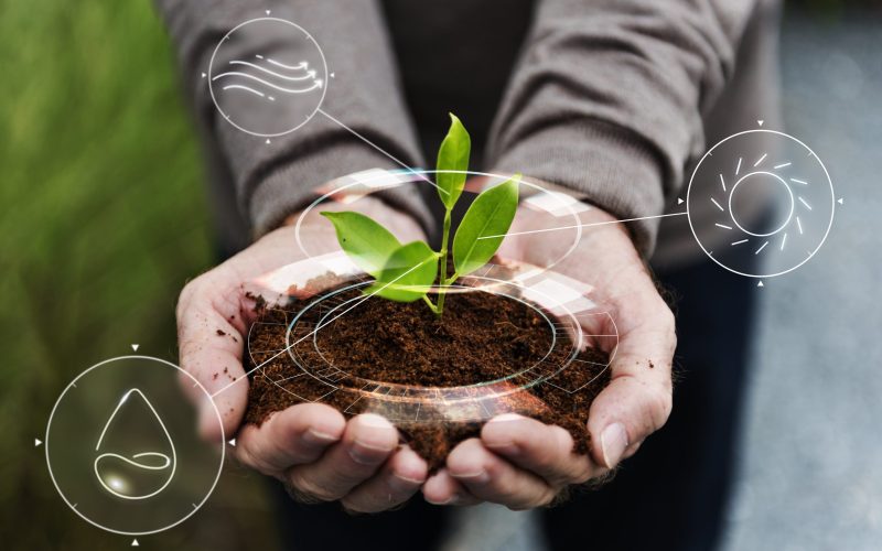 smart-agriculture-iot-with-hand-planting-tree-background-min